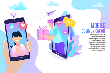 Hand holding smartphone with woman on video call receiving surprise gift box from man popping out of tablet screen. Mobile communication concept with chat bubbles and love icons online relationship.