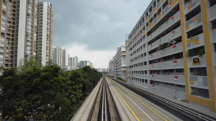 Autonomous Driverless Light Rail Train Driving On Elevated Tracks in City of Singapore