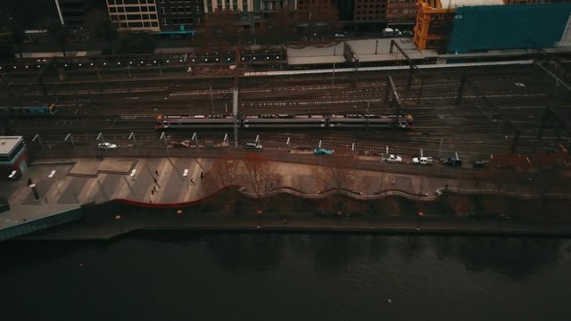 Aerial view of Central Business District CBD in Melbourne, Victoria, Australia, including Yarra River, bridges, trains, railway and Flinders Street Station.