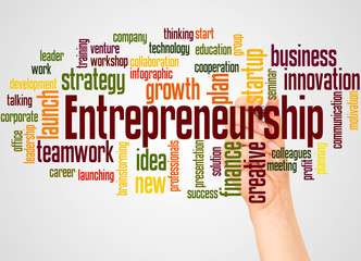 Entrepreneurship word cloud and hand with marker concept