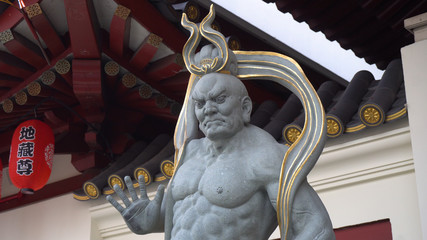 Stone Warrior Statue At Chinese Temple