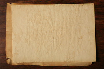 Old paper on brown wood