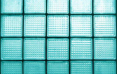 Light blue surfaces dirty glass block wall for effect background.