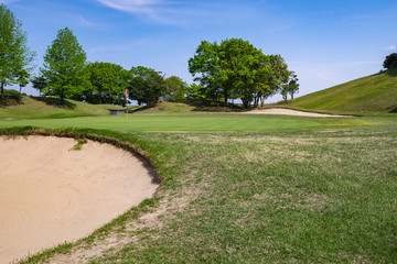 View of Golf Course with beautiful putting green. Golf course with a rich green turf beautiful scenery.