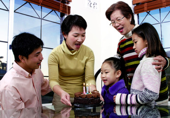 Girl celebrating her birthday with her family