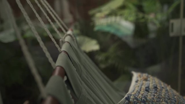 Detail of a swing in tropical island of Bali (120fps conformed to 60fps)
