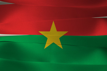 Colorful ribbon as Burkina Faso national flag, red and green and star.