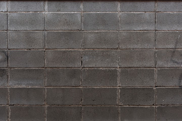 Masonry wall made of gray rectangular stone
