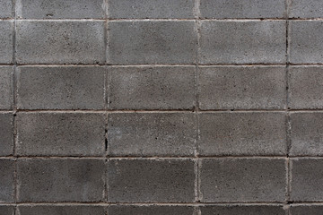 Masonry wall made of gray rectangular stone