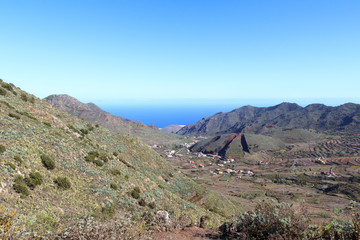 Fototapeta na wymiar Village El Palmar and volcano Montana del Palmar panorama on Canary Island Tenerife, Spain