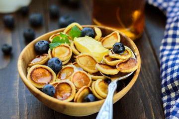 Trendy comfort food - pancakes cereal in bowl