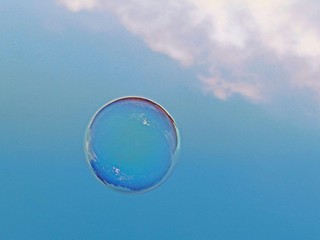 Low Angle Close-up Of Bubble Against Blue Sky