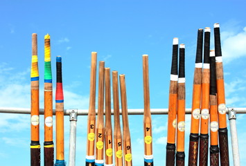 Sport Regatta oars stood up against blue sky backgroud © Dennis