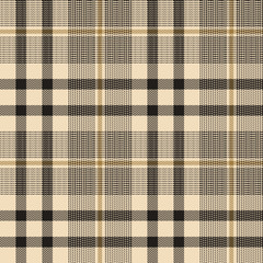 Tartan plaid pattern background. Seamless herringbone check plaid graphic in black and gold for jacket, skirt, trousers, blanket, throw, or other modern autumn winter fabric design.