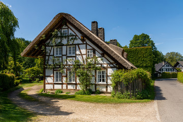 Fototapeta na wymiar Höfen, Germany - May 17, 2020: Street with traditional half-timbered houses