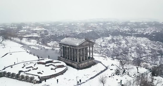 old Greek temple in Armenia stone Church in the snow on a mountain in winter