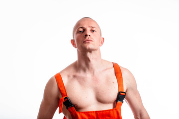 Sexy construction worker on a white background. Builder with a helmet on his head. Sexy builder.