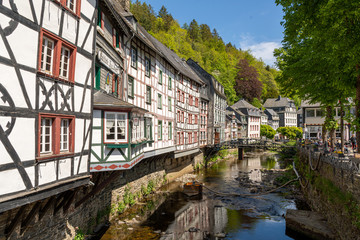 Fototapeta na wymiar Monschau, Germany - May 17, 2020 Half-timbered houses at the river Rur