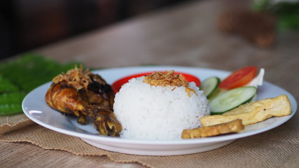 grilled chicken food with rice and chili seasonings and onions