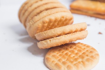 Stack of cookies on white background, selective focus