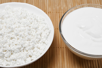 bowls with cottage cheese and sour cream on the table