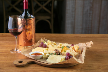 Gourmet dinner with cheese and wine in the restaurant. Romantic dinner.