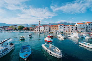 Kastel coast in Dalmatia,Croatia. A famous tourist destination on the Adriatic sea. Fishing boats moored in old town harbor.