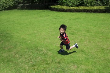 Fototapeta premium Boy running in the park