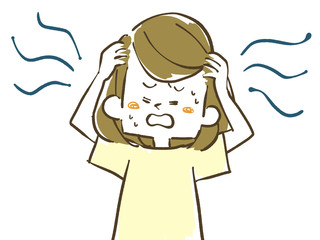頭を抱える女性