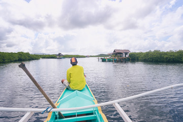 Vacation in Philippines. Sailing the sea on traditional boat.
