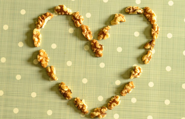 Peeled California Walnut Kernel On Blue Background With White Dots