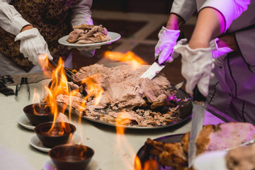 appetizing grilled meat on fire close-up. beautiful presentation of the dishes in the restaurant