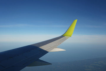 Plane wing, view from porthole                            