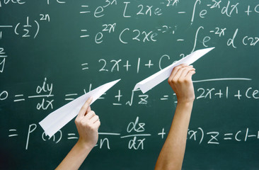 Hands holding paper planes