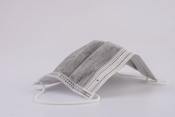 Activated carbon disposable fiber face masks isolated on white background. 