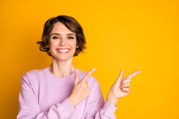 Portrait of positive cheerful girl promoter point index finger copyspace present ads promotion...