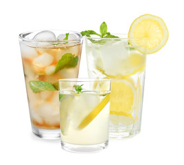Set of refreshing nonalcoholic drinks on white background