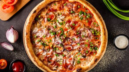 Italian Cuisine. Thin pizza with bacon, red onion, green onion and mushrooms in tomato sauce. Background image. copy space