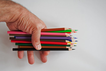 hand holding colorful pencil