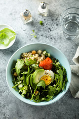 Homemade healthy quinoa bowl with avocado and egg