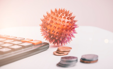 Coronavirus or covid-19 ncov on the economy. Coins, calculator on the desk. Medicine and money concept, expenses for quarantine. Economic recession.