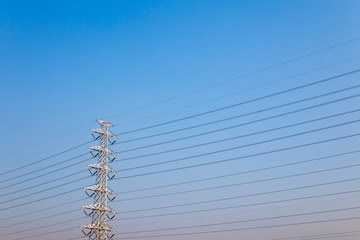 High voltage post,High voltage tower on clear blue sky