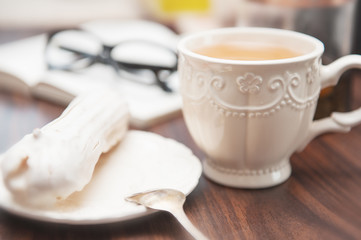 Fototapeta na wymiar Cup of tea and cake. Cozy home concept