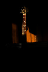 Bass guitar in music studio shot at golden hour