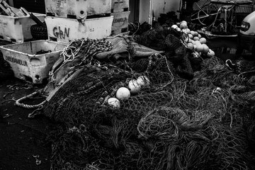 Landscape in the town of Ólafsfjörður in the north of Iceland. You can see an abandoned fishing nets in the old port.