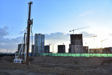 Vertical tamrock pile foundation drilling machine. Drill rig at construction site. Ground...
