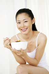 Woman enjoying her breakfast cereal