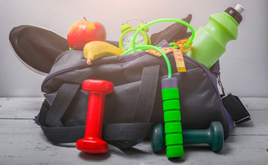 Fototapeta premium Sports bag with sports equipment isolated on white with clipping path