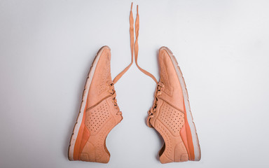 Sport stylish sneakers in form like a lungs. Run for lungs. Health care coneptual image.