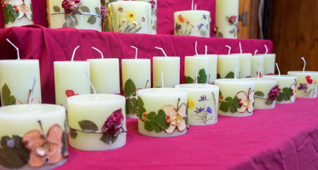 handmade candles with fruit slices and flowers for sale at christmas tradition market. Budapest, Hungary